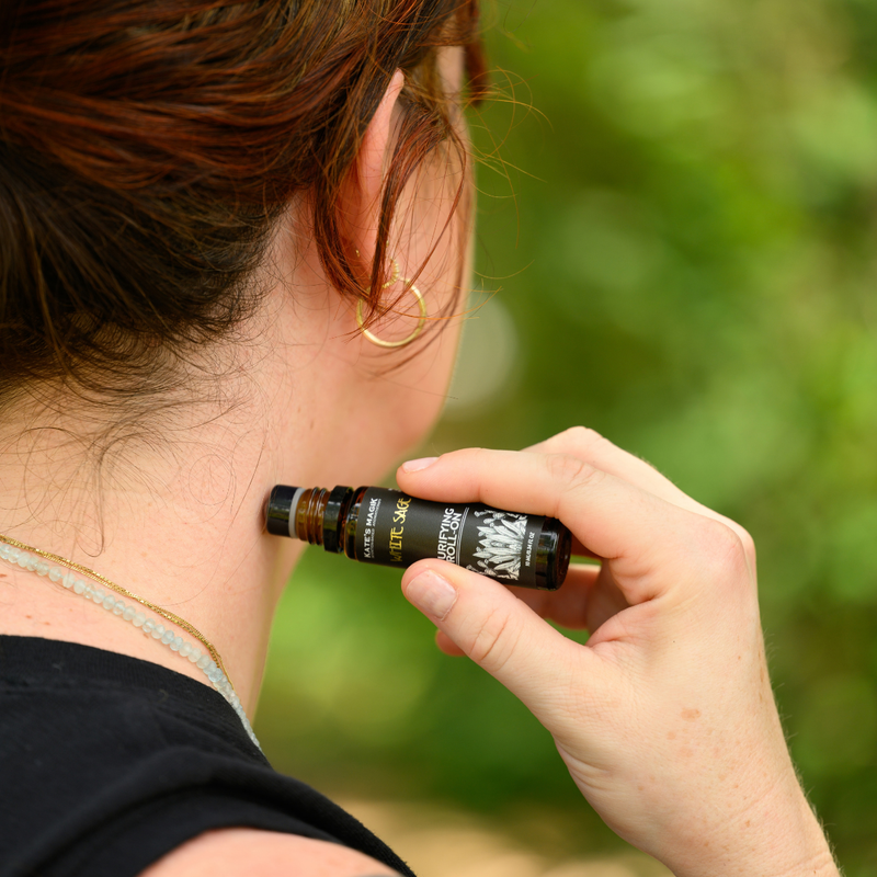 Applying an Anointing Oil roll-on to the wrist