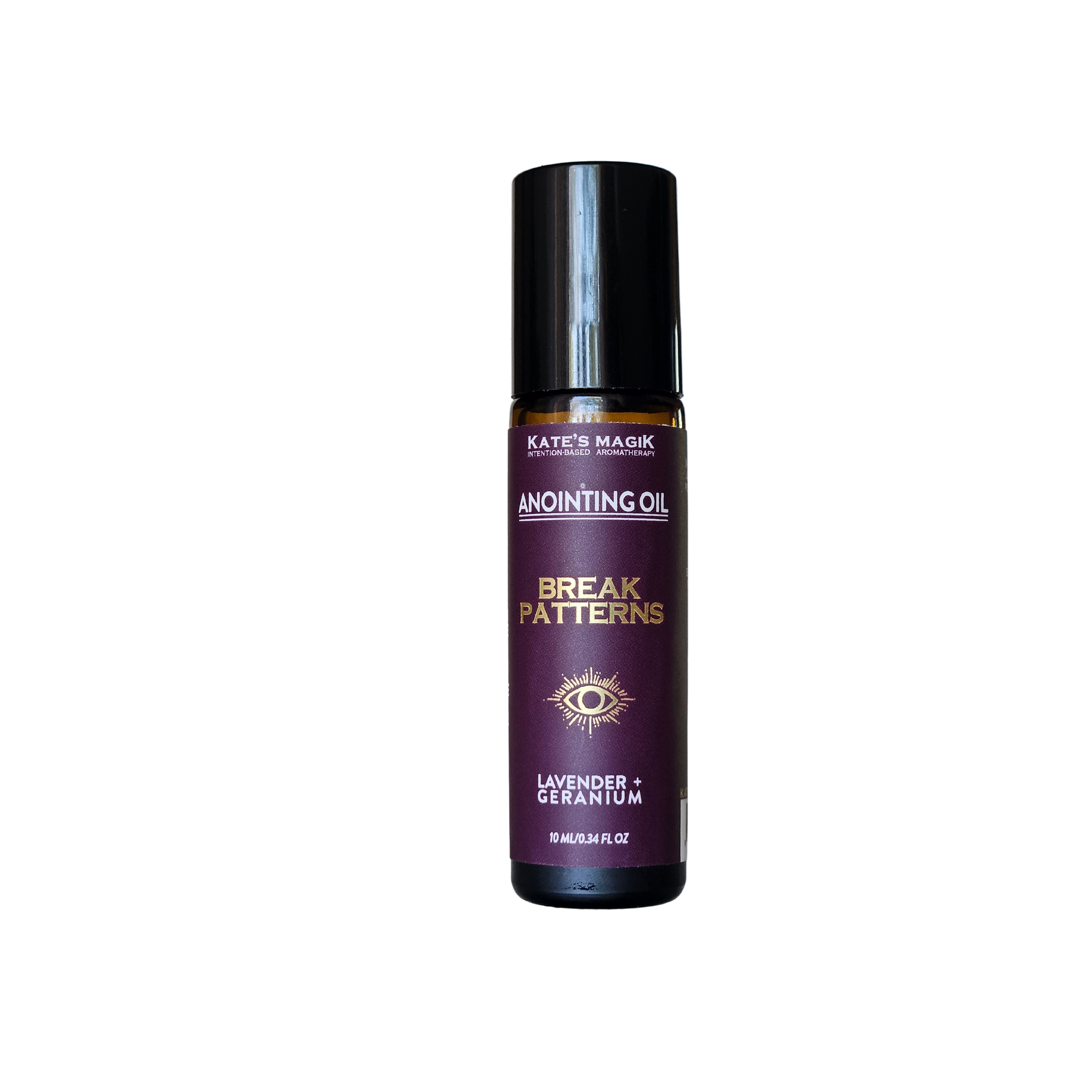 A bottle of Kate's Magick 'Break Patterns' anointing oil, featuring a dark purple label with gold and white text, and a black cap, set against a plain white background.