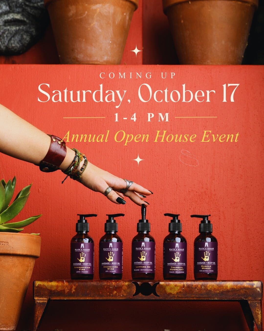 Promotional graphic for an annual open house event, featuring five purple pump bottles of a massage product lined up on a rustic wooden table against a terracotta background. A person's hand with bracelets and rings is reaching toward the center bottle.