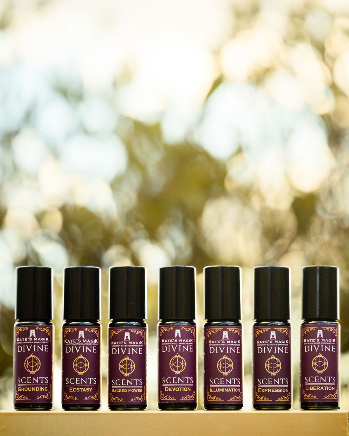 Grounding, Sacred Power, and Ecstasy Divine Scents natural perfume roll-ons from Kate’s Magik in warm autumn light