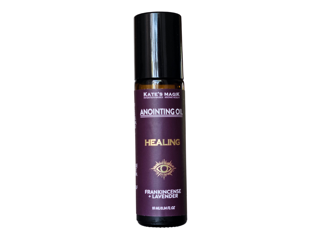 Healing  Anointing Oil from Kate's Magik, 10ml roll-on amber glass bottle with black cap on a white background, purple label with gold lettering