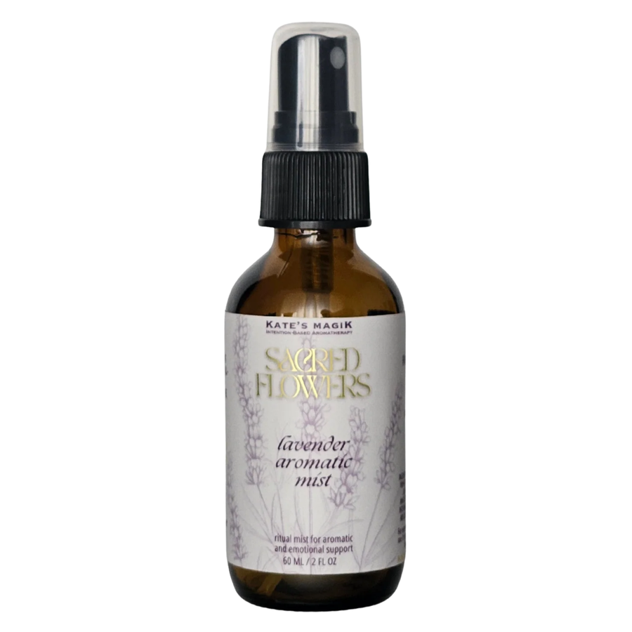 A 60 mL amber glass spray bottle of Kate's Magick Sacred Flowers Lavender Aromatic Mist with a black spray cap and a white label featuring lavender illustrations.