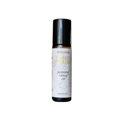 A bottle of Kate's Magic Sacred Flowers Jasmine Ritual Oil on a plain white background. White label with pale green jasmine flower vines