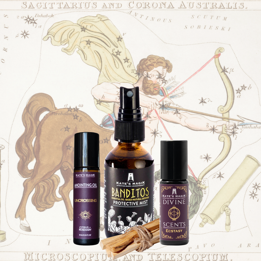 A product bundle made for the Sagittarius Zodiac from Kate's Magic featuring a large Banditos Protective Mist spray bottle, a 'uncrossing' roll-on anointing oil bottle, and a Ecstasy Divine scent natural perfume roll-on bottle, arranged with a bundle of Palo Santo sticks in front of a celestial Sagittarius zodiac chart background.